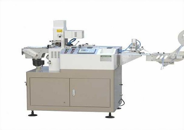 Trademark cutting and folding machine